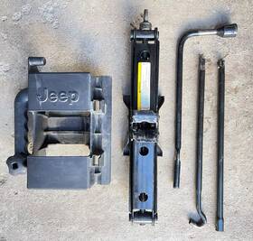 56052848aa Jeep 2002/7 Liberty Tire Jack Set With Tools And Carrier Oem