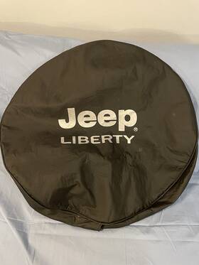 82206926ac Mopar 2002-2007 Jeep Liberty Tire Cover Bright Silver Logo Oem