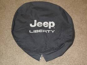 82207586 Mopar 2002-2007 Jeep Liberty Tire Cover Bright Silver Black With Logo Genuine Oem