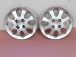 Kia Rio 2003-2005 Wheel Covers Hub Caps Pair Silver Plastic Each 14" 8 Spoke. Fixed Price $56.40.