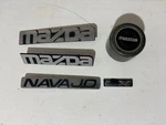 Mazda Navajo Lx Emblem Set And One Wheel Center Cap Used Explorer Ford. Fixed Price $30.00.